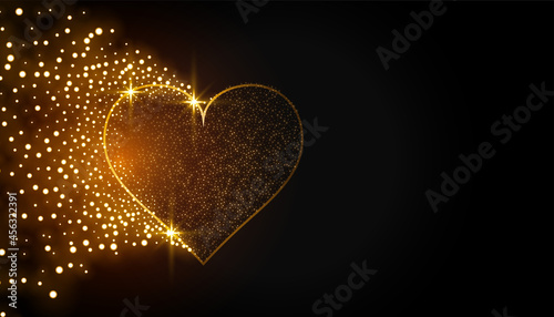 sparkling golden heart on black background