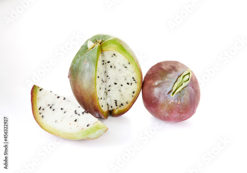 Peruvian apple cactus fruit isolated on white background. Scientific name Cereus repandu photo