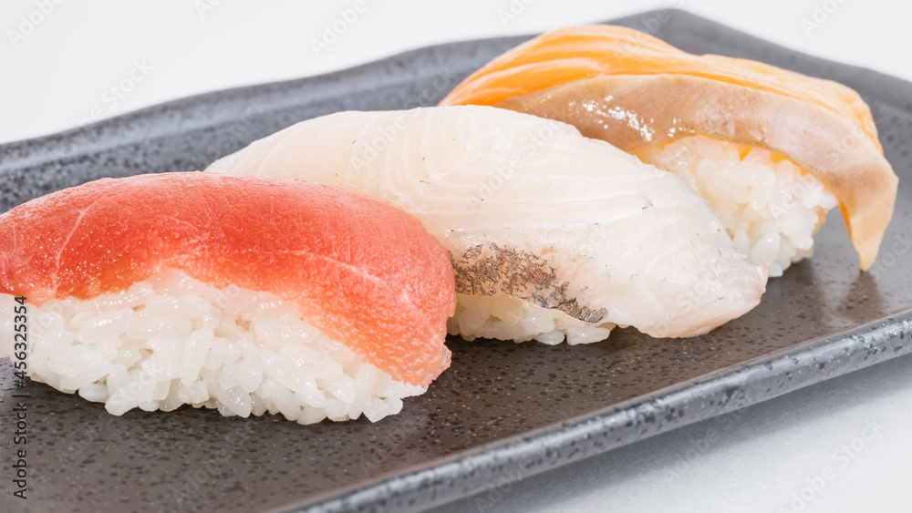 Overhead Japanese sushi food with tuna, salmon and Sea Bream, Top view of assorted sushi, Culture or Tradition Background Overhead Japanese sushi food with tuna, salmon and Sea Bream, Top view of assorted sushi, Culture or Tradition Background