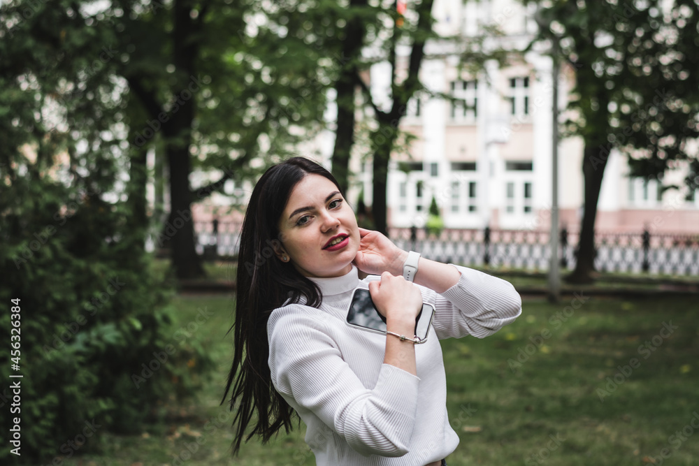 Stylish beautiful brunette girl in a summer city Stylish beautiful brunette girl in a summer city