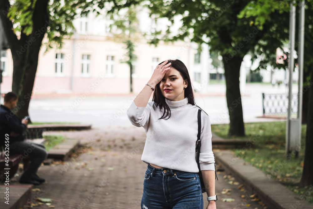 Stylish beautiful brunette girl in a summer city Stylish beautiful brunette girl in a summer city
