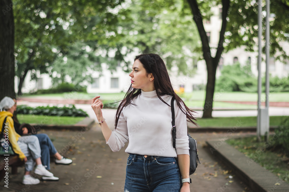 Stylish beautiful brunette girl in a summer city Stylish beautiful brunette girl in a summer city