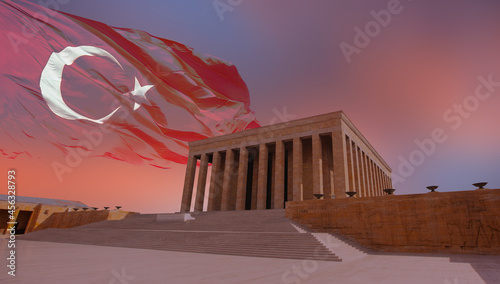 Anitkabir, Mausoleum of Ataturk with dramatic cloudy sky on the background blured Image of Turkish flag - Ankara Turkey