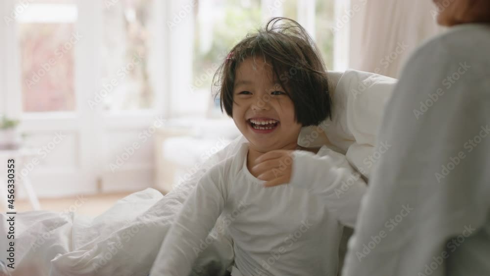 happy asian family with children jumping on bed playing with mother and father having fun on weekend morning excited little kids enjoying game with parents at home 4k footage happy asian family with children jumping on bed playing with mother and father having fun on weekend morning excited little kids enjoying game with parents at home 4k footage
