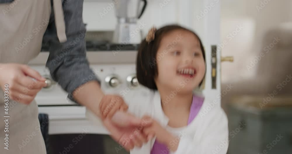 happy asian family dancing in kitchen father enjoying dance with daughter little girl laughing enjoying exciting weekend at home 4k footage
