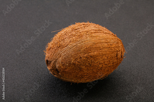 Tropical brown coconut over background