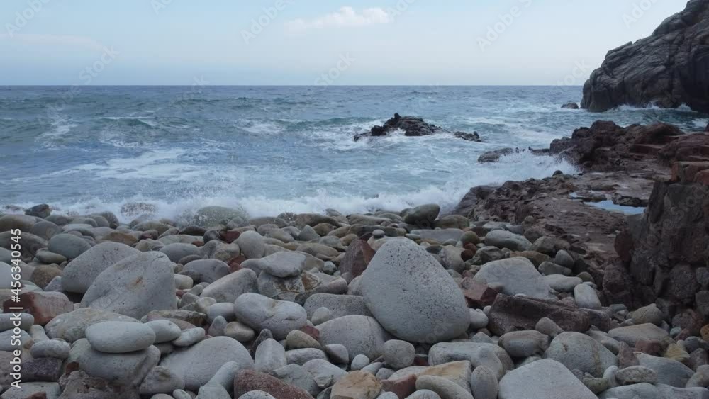Waves crashing on a stones beach, sea fixed view Waves crashing on a stones beach, sea fixed view