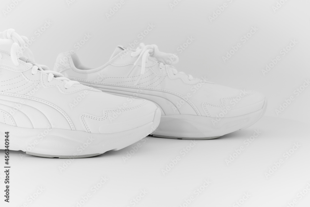white sneakers with laces on a white background. isolate. side view