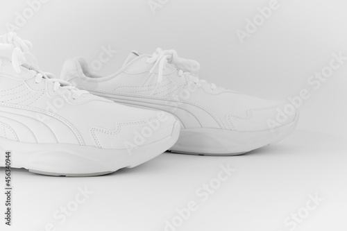 white sneakers with laces on a white background. isolate. side view