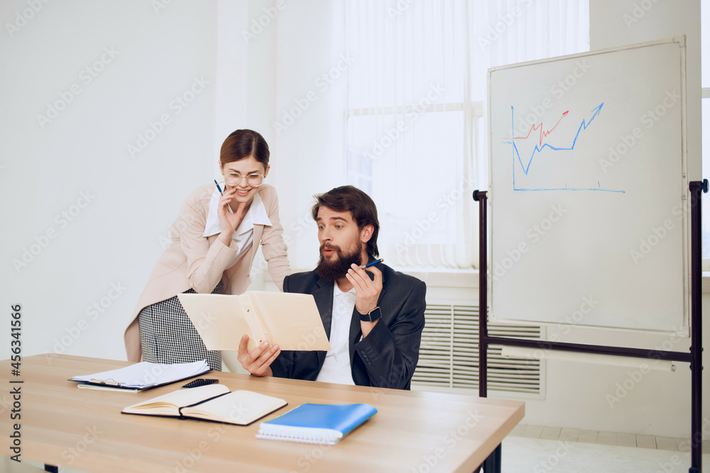 business man sitting at his desk next to the secretary communication work business man sitting at his desk next to the secretary communication work