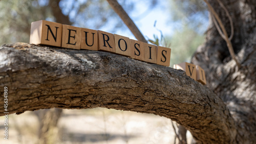 фотографія The word neurosis was created from wooden blocks