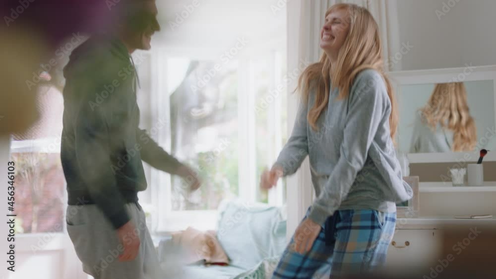 happy young couple dancing at home celebrating having fun weekend morning together enjoying funny dance in bedroom successful relationship celebration 4k footage happy young couple dancing at home celebrating having fun weekend morning together enjoying funny dance in bedroom successful relationship celebration 4k footage