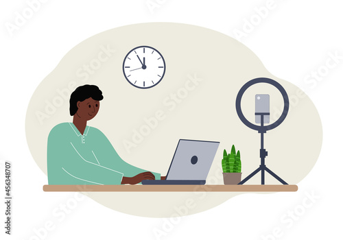 Illustration of a male blogger at the table with a laptop. Online filming of a training course or blog