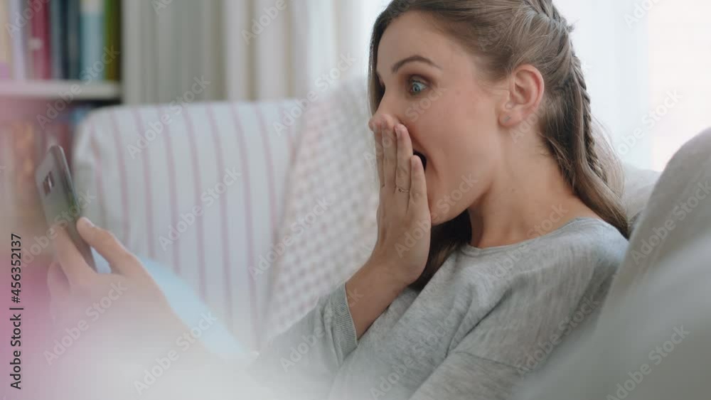 beautiful woman having video chat using smartphone looking surprised enjoying good news chatting on mobile phone at home 4k footage beautiful woman having video chat using smartphone looking surprised enjoying good news chatting on mobile phone at home 4k footage