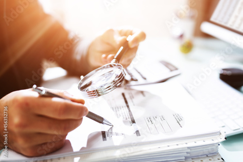 Audit And Fraud Investigation. Auditor Using Magnifying Glass