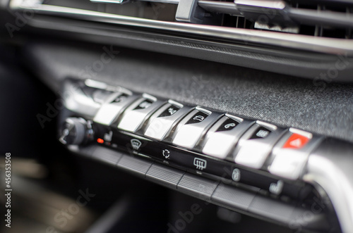 multimedia control console and climate in a modern car. close-up, selective focus, no people