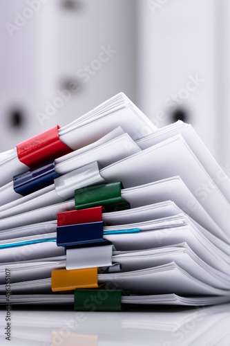 Stacked Documents And Eyeglasses photo