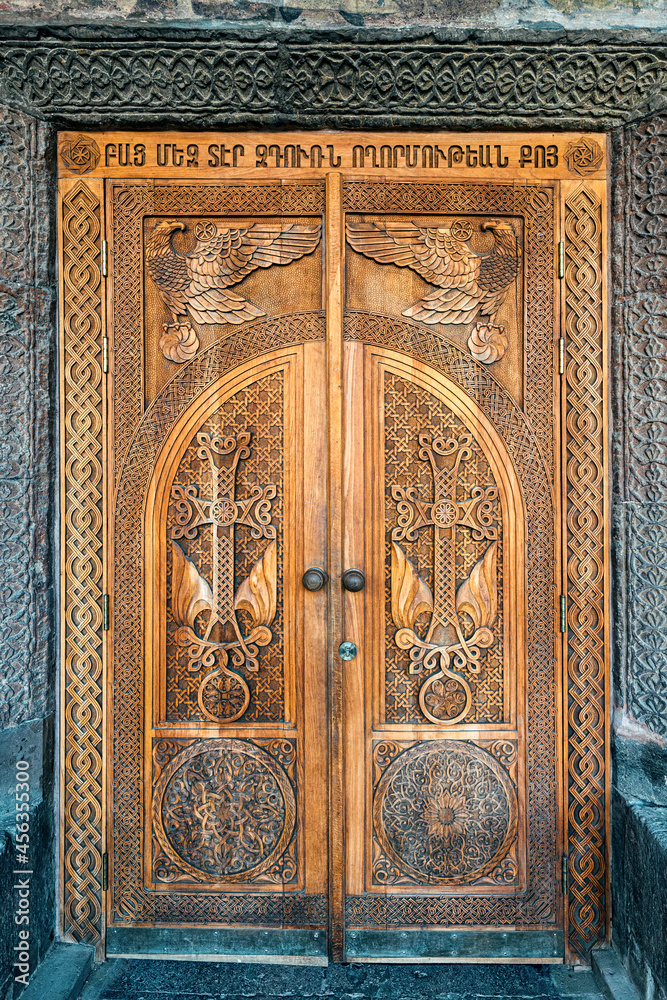 entrance to the church of St. Gayane in Armenia with a wooden carved door