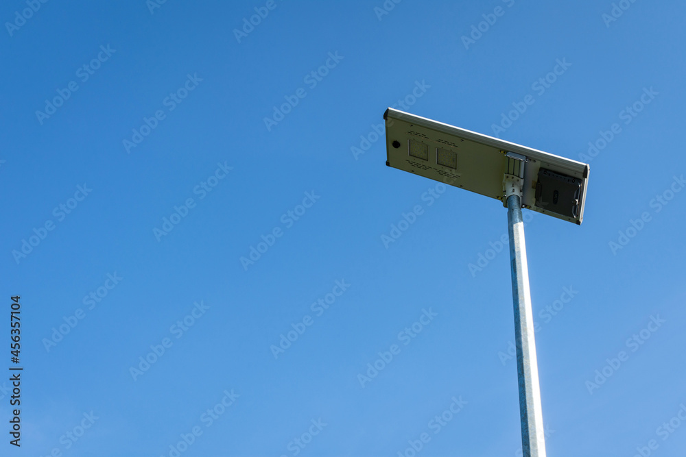 Solar cell panel LED lighting pole on blue sky background. Solar cell panel LED lighting pole on blue sky background.