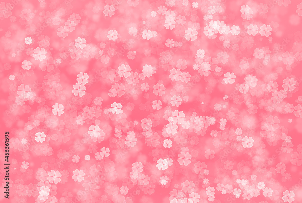 Abstract bokeh background in pink colour of four leaf clover pattern. Defocus Concept