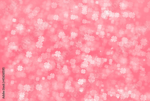 Abstract bokeh background in pink colour of four leaf clover pattern. Defocus Concept