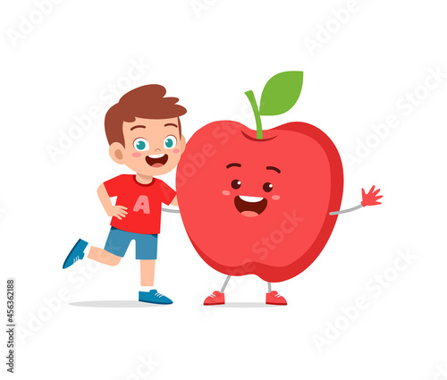 cute little boy stands with apple character