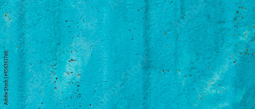 Cracked painted old metal texture. Abstract background of painted turquoise surface. Grunge blue wall background © Lazartivan