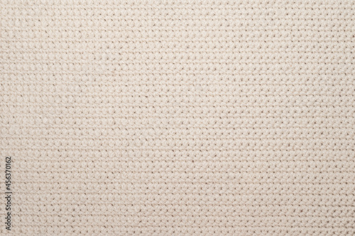 Close up of threaded beige textile
