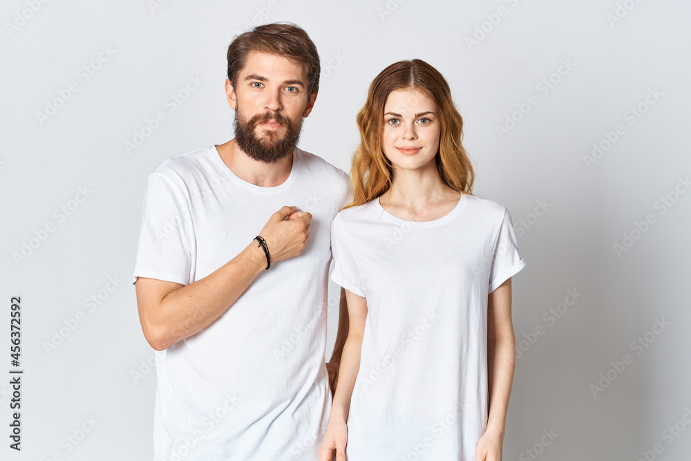 man and woman stand side by side in white t-shirts Copy Space mockup design man and woman stand side by side in white t-shirts Copy Space mockup design