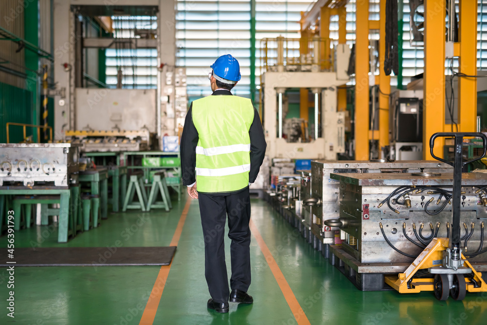 Factory manager walk to check production warehouse Factory manager walk to check production warehouse