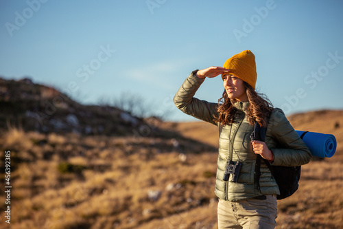 Portrait of happy female hiker enjoying in view