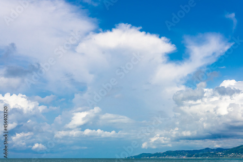 White clouds against a blue sky.