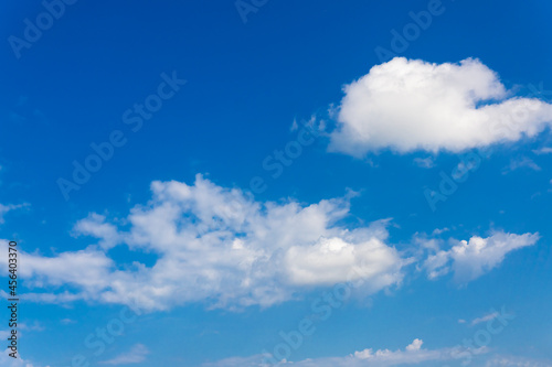 White clouds float in the blue sky.