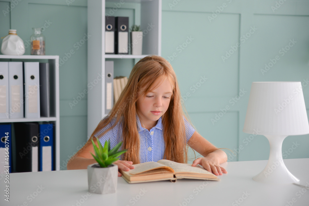 back to school. little girl student doing homework on a laptop. distance learning concept back to school. little girl student doing homework on a laptop. distance learning concept