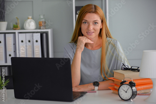 young businesswoman works in the office at the computer. freelancer woman