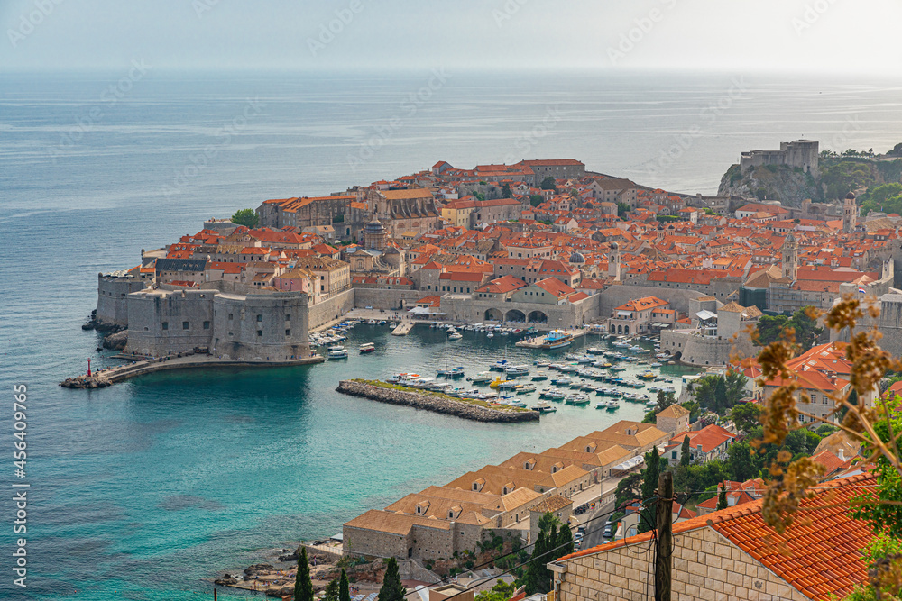 View Old Port of Dubrovnik old town with yachts and boats in blue waters of Adriatic sea, Croatia
