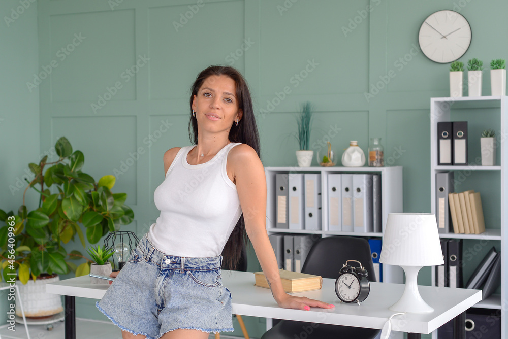 portrait of a beautiful young business woman working in the office. freelancer works