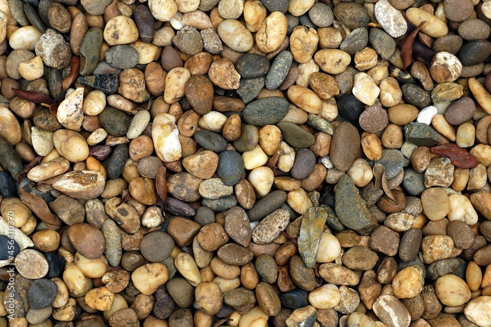 A surface mix brown stone for texture and backgrounds. A surface mix brown stone for texture and backgrounds.