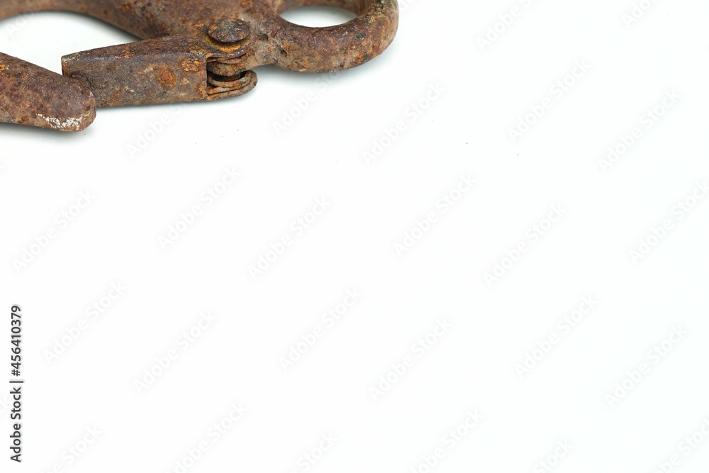 Obraz premium A vintage hook peeling was rustting on body cause oxidation lay down white backgrounds on the top left position.
