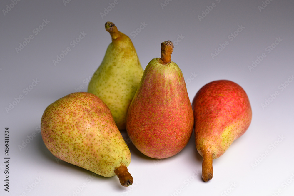 Fresh bio pears on grey background. Organic fruit for food or pear juice. Healthy food. Pear harvest. Fresh bio pears on grey background. Organic fruit for food or pear juice. Healthy food. Pear harvest.