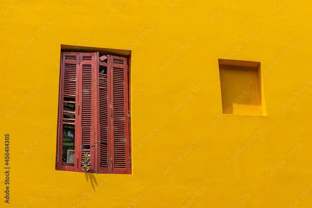 Caminito Street in La Boca with the colorful window and a yellow wall, Buenos Aires