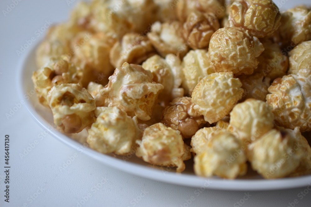 Popcorn covered with icing and caramel with sugar Popcorn covered with icing and caramel with sugar