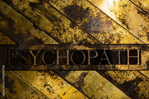 Psychopath text on vintage textured copper and gold background photo