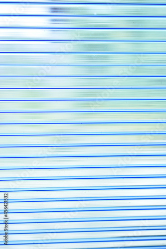 Blue bright stripes of polycarbonate in the light