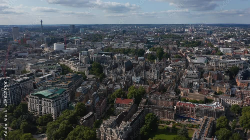 Aerial view of large city. Historic Royal Courts of Justice buildings complex and buildings in Temple Gardens among newer houses. London, UK Aerial view of large city. Historic Royal Courts of Justice buildings complex and buildings in Temple Gardens among newer houses. London, UK