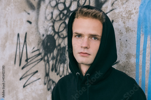 Obraz na płótnie portrait of sad handsome teenager in hoodie w salonie
