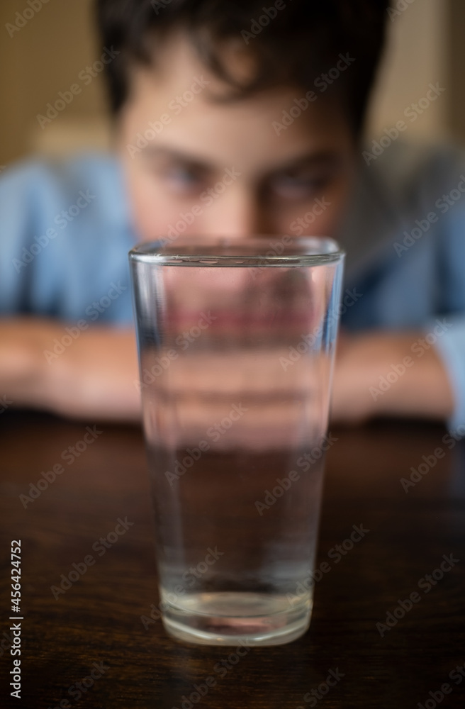 A child with a glass of water A child with a glass of water