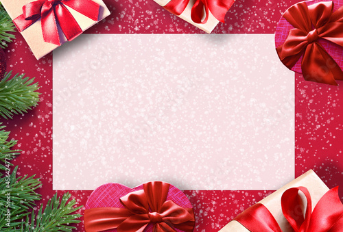 Fir branch with Christmas decorations on pink background. Holiday concept.