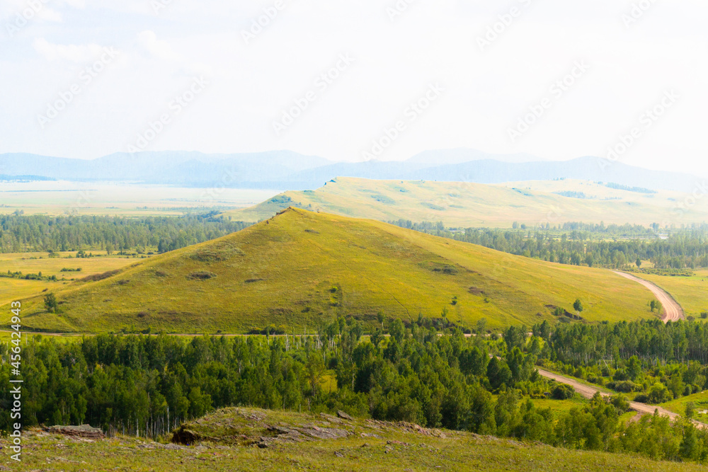 Summer landscape of the Sunduki mountain range located in the valley of the Bely Iyus River in Khakassia, Russia.
