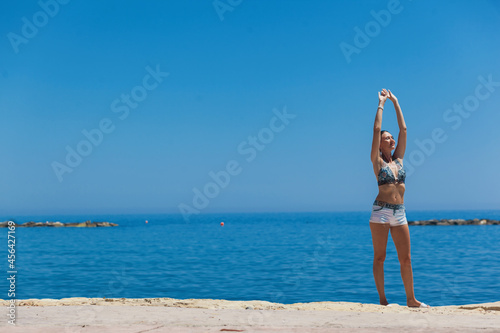 Young woman enjoying beautiful day at the beach. Cyprus